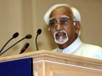 Hamid Ansari speaking on a podium