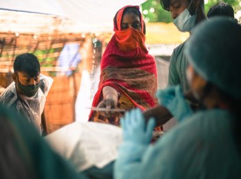 Reshma with her 'passbook' to collect ration kit provided by Oxfam India.