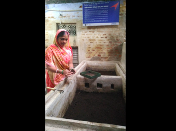 Babita Devi working the vermicomposting pit