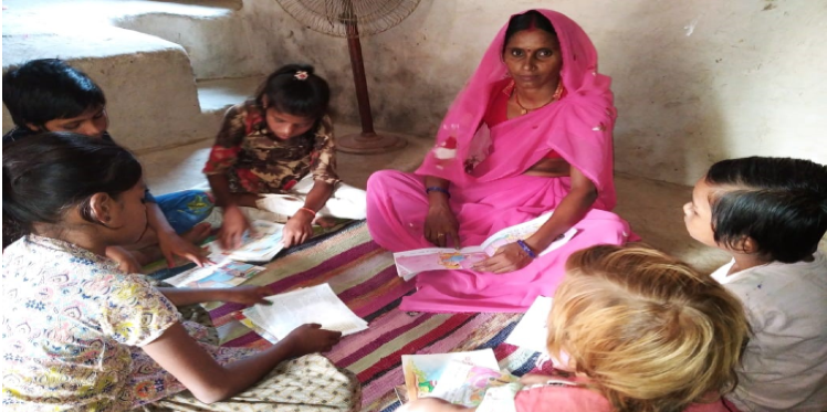 Devkali teaching children of her community.