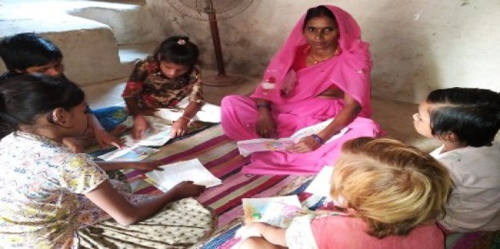 Breaking disability barriers. Devkali teaching children of her community